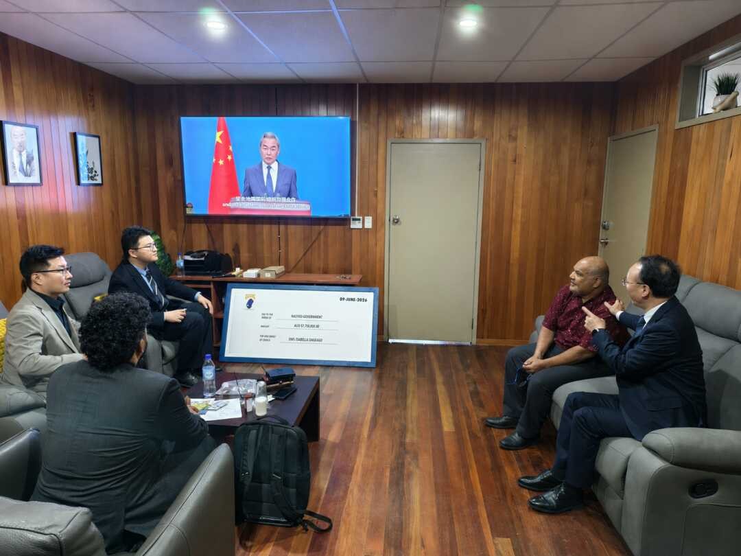 Ambassador Jin and Minister Bernicke watching Wang Yi's UN address