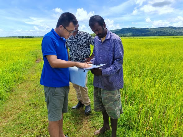 Chinese Agricultural Expert with a Fijian Farmer